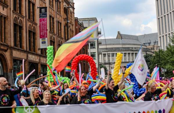 People celebrating Manchester Pride during the parade