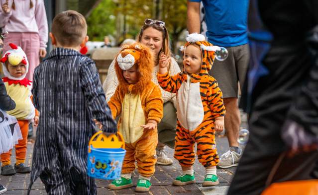 Children in costume gather for Halloween activities.