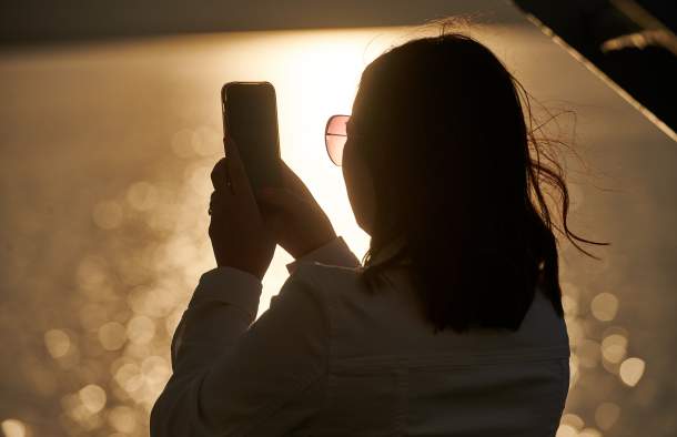 woman taking selfie at lake champlain