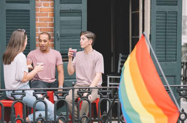 LGBTQ Friends Having Drinks on a French Quarter Balcony