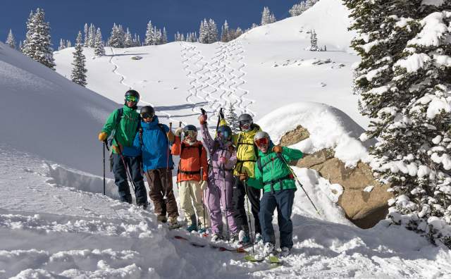 Skiers pose for a group photo in the Wasatch Backcountry
