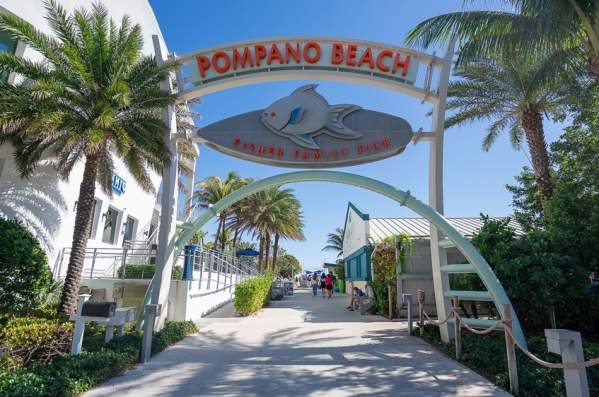 An archway at the entrance to the Pompano Beach Fisher Family Pier.