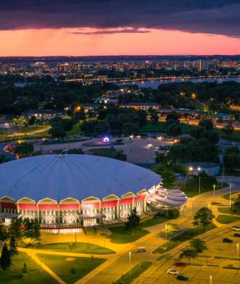Aerial image of Alliant Energy with the sun setting in the background
