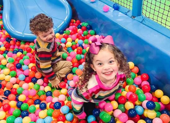 kids in a bubble cage