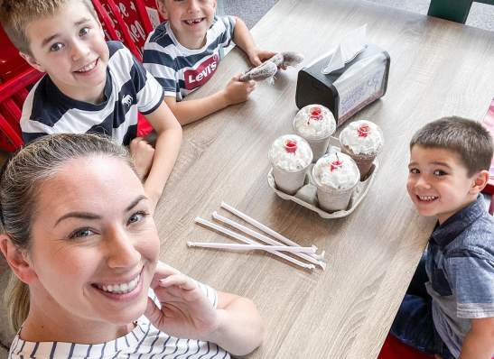 boys and mom with milkshakes and smiles