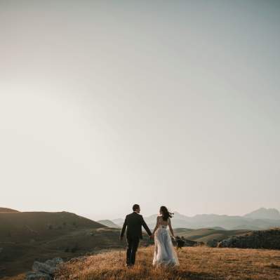 Wedding Couple Standing on the Hills