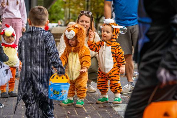 Children in costume gather for Halloween activities.