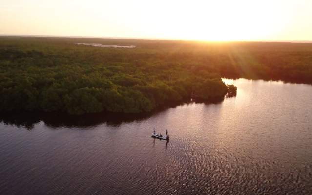 Aerial shot of Capt. Jay Withers fishing at sunset