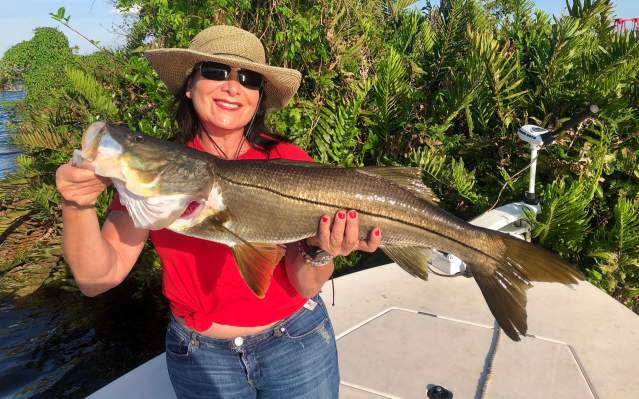 Fishing: Woman holding a nice trophy snook