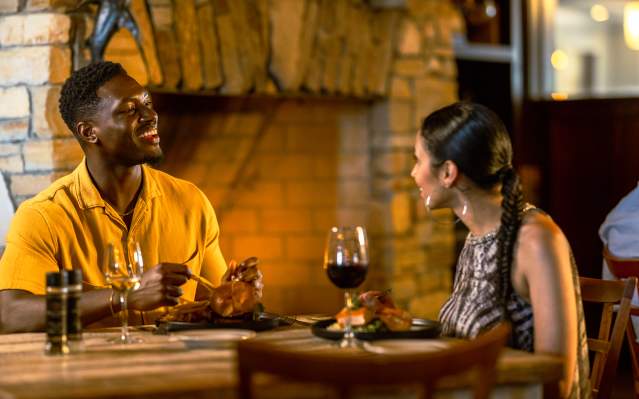 Couple eating at Winesett House in Punta Gorda, a Best of Florida Seafood Restaurant honoree, on an October evening.