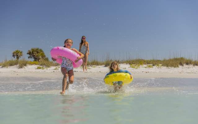 Family enjoying the water and beach on Don Pedro Island in Punta Gorda/Englewood Beach