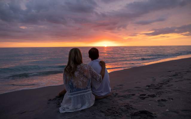 Couple enjoying sunset on the beach in Punta Gorda/Englewood Beach