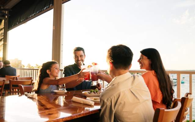 Family of four enjoying a meal at Laishley Crab House in Punta Gorda, Florida