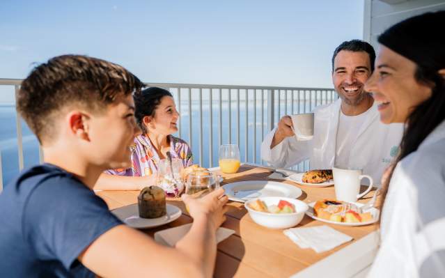 Two parents and two kids enjoying breakfast at Sunseeker Resort Charlotte Harbor