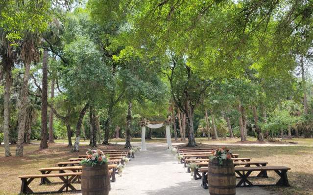 Outdoor ceremony setup at Cypress M Ranch Western Weddings and Special Events Venue in Punta Gorda, Florida on a beautiful May day.