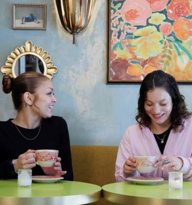 Two women enjoy coffee at Rosa Blanca in Allentown, PA.
