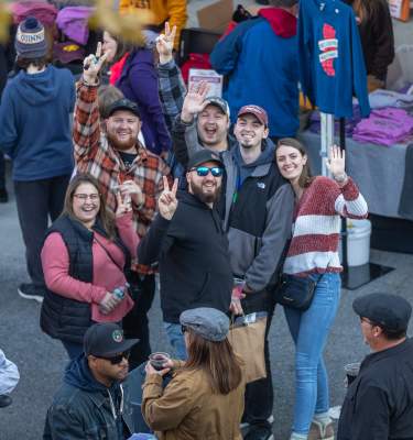 Attendees wave to the camera at PA Bacon Fest in November