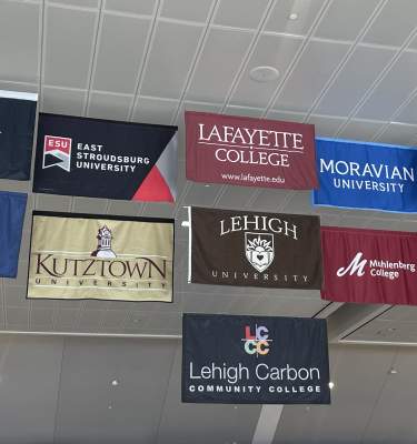 College banners hang outside the new security checkpoint at Lehigh Valley International Airport (ABE) in Lehigh Valley, PA