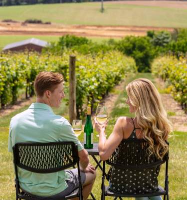 A couple tasting wine in the vineyards of Vynecrest, Lehigh Valley Pa.