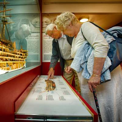 Couple looking at display in museum at Bucklers Hard Museum in the New Forest - Attractions