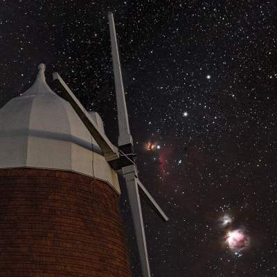Halnaker Windmill with starry skies behind