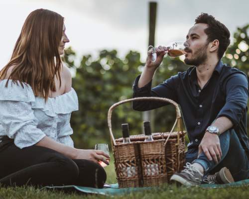 A couple enjoying a picnic at Little Wold Vineyard in East Yorkshire