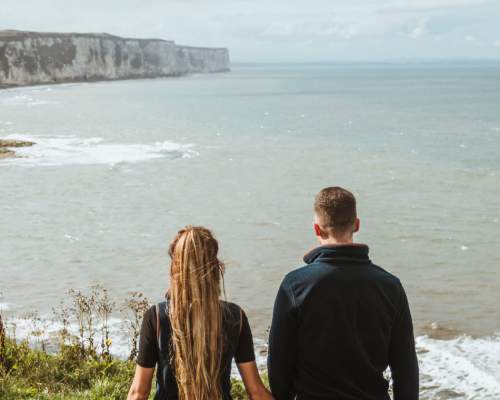 A couple walking along the coast at Flamborough