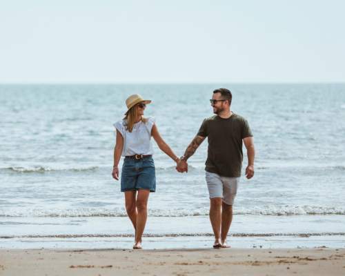 Couple walking on an east yorkshire beach