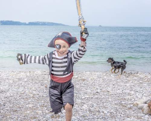 Pirate on Brixham Beach with dog