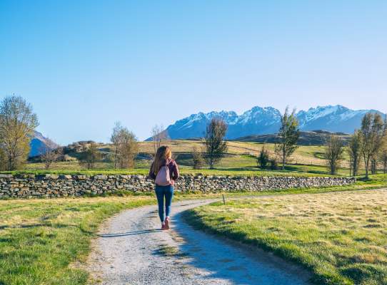 Woman taking a walk around Jacks Point in spring