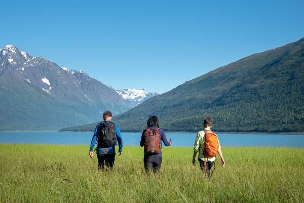 Hikers stroll the lake shore at Eklutna Lake north of Anchorage.