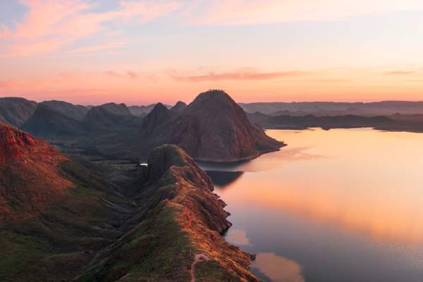 A drone view of a walking/mountain bike trail leading to an elevated lookout point at Lake Argyle