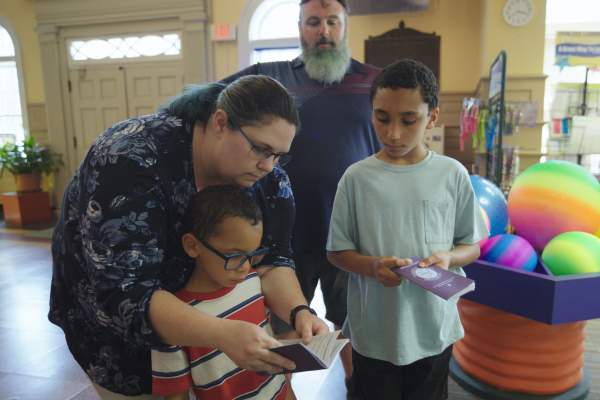 A family of four visit Fayetteville's Fascinate-U Children's Museum with their Cumberland County Destination Passport