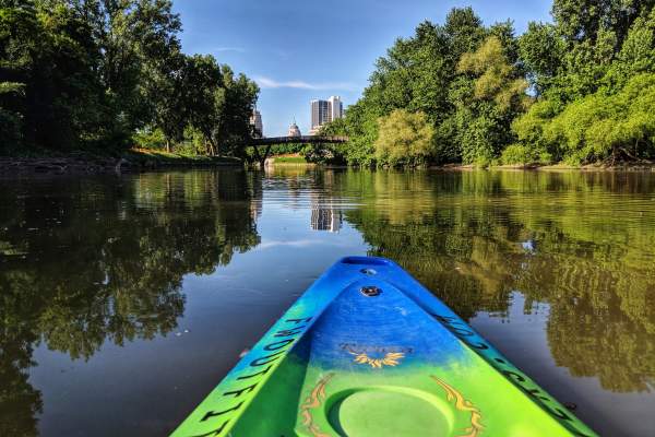 Kayaking Fort Wayne's rivers with a view of the skyline.