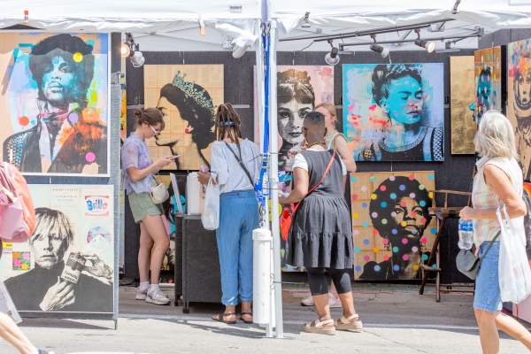 People looking at art during Ann Arbor Art Fair