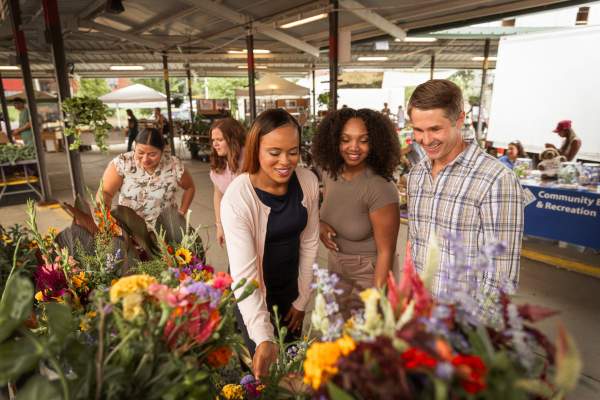 Group of people looking at items at the Ann Arbor Farmers Market