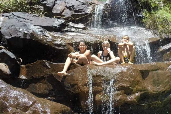 Children at a freshwater swimming pool on a Kimberley Wild Expeditions Family Safari