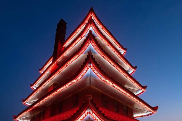 The Pagoda lit up at night with bright red lights