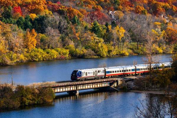 Amtrack Train crossing Huron River in Fall