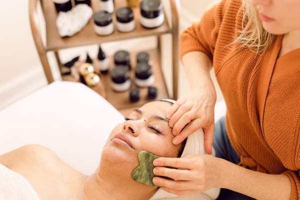 Woman getting spa service at K.West Skin Body Spirit