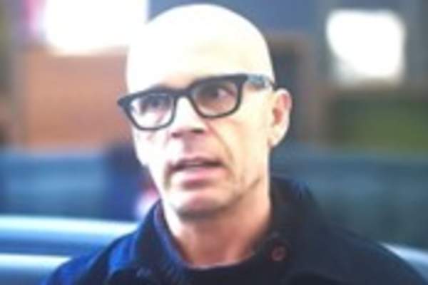 Headshot of man with glasses