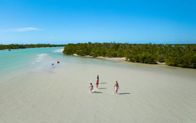 Family enjoying the shoreline at Stump Pass Beach State Park