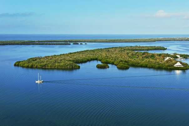 Sailboat gliding through the water off of Cabbage Key