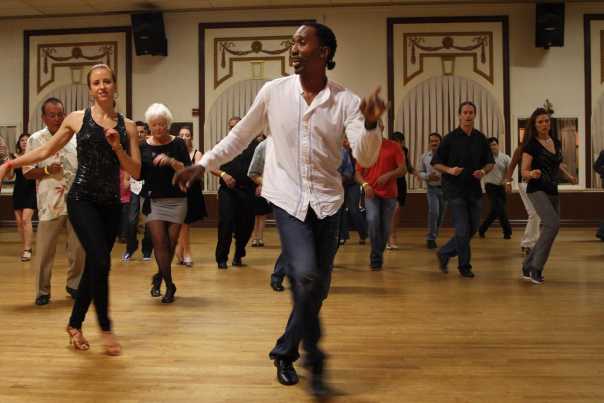 People dancing salsa at Salsa Caliente Dance Studio, in Tampa’s Ybor City