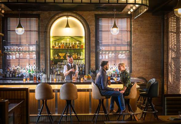 2 people sit at a bar in Madison, Wisconsin