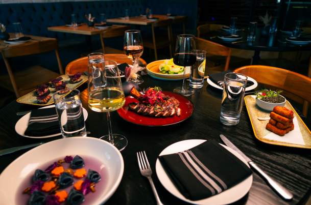 In Bloom restaurant table of food and drinks