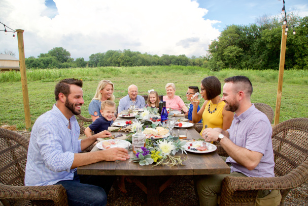Group of people eating outdoors