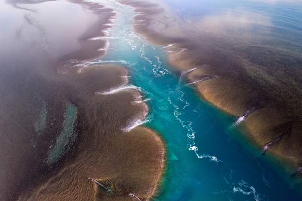Aerial view of a channel flowing through Yowjab/Montgomery Reef on the Kimberley Coast