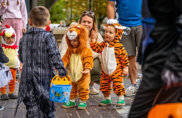 Children in costume gather for Halloween activities.