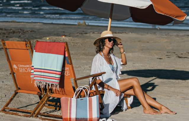 Leisure pooh of a woman lounging on beach chairs under an umbrella